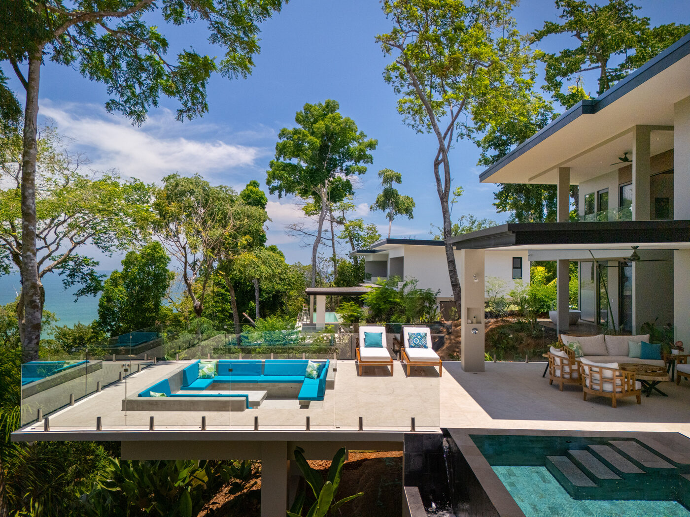 The sunken firepit lounge set over the ocean view beside the pool