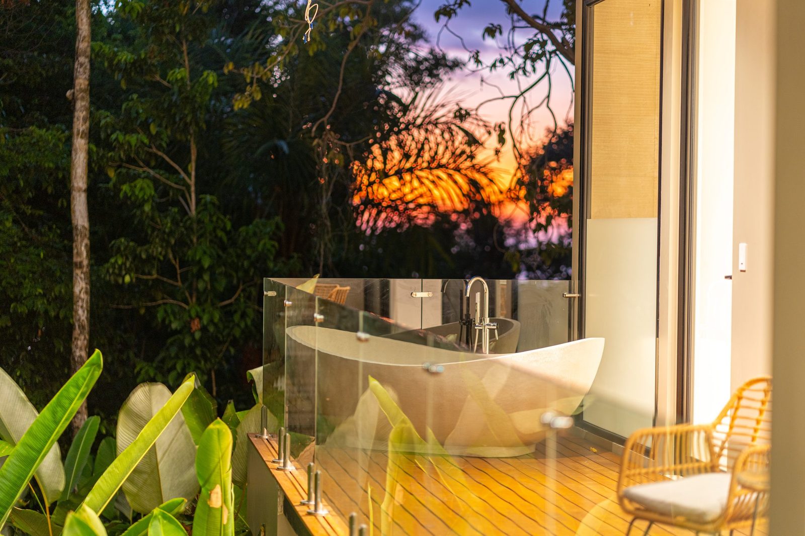 The villa glowing at twilight